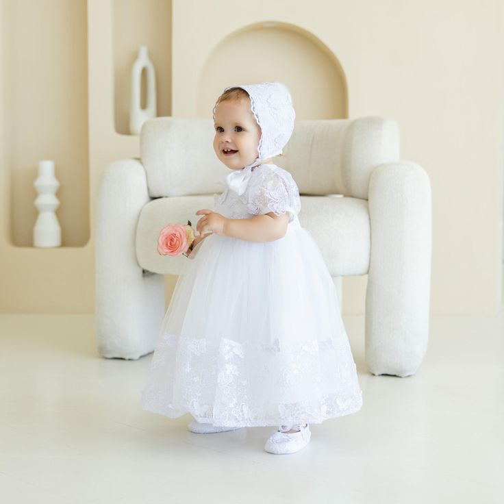 Embrace the sacred moment of your baby girl's baptism with our exquisite Christening Dress. This elegant gown is crafted with the utmost care, ensuring your little one looks angelic and radiant on this special day. Soft, luxurious fabrics drape gracefully, creating a timeless silhouette that will captivate all who witness your child's blessing Princess Tulle Baptism Dress For First Communion, Princess Style Tulle Baptism Dress For First Communion, Princess Style Fitted Baptism Dress For First Communion, Princess Style Baptism Dress For First Communion, White Princess Baptism Dress, Princess Lace Baptism Dress, White Tulle Baptism Dress For Ceremony, Princess Style Lace Baptism Dress, White Princess Gown For First Communion