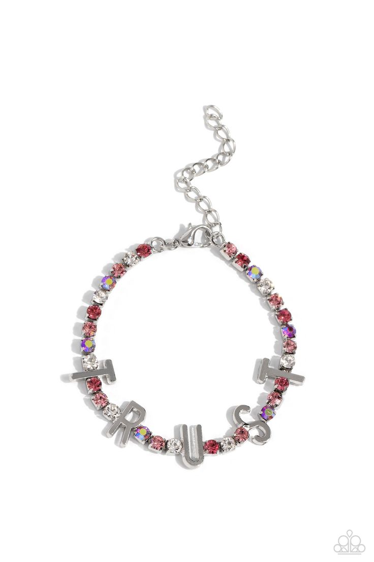 Set in silver square fittings, various pink, pink iridescent, and white rhinestones gleam around the wrist. Infused along the design, sleek silver letters spell out the word "TRUST" for an inspirational finish. Features an adjustable clasp closure. Due to its prismatic palette, color may vary. Sold as one individual bracelet. Ear Cuff Jewelry, Pink Iridescent, Jewelry Boutique, Palette Color, Purple Earrings, Paparazzi Accessories, White Rhinestone, Chic Jewelry, Paparazzi Jewelry