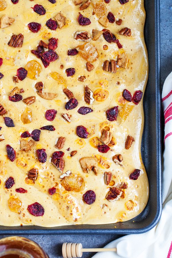 a pan filled with fruit and nuts on top of a table