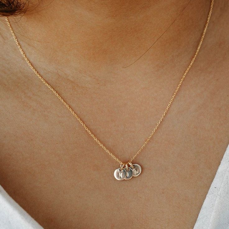 Our tiniest and best selling necklace! The Mila necklace is a constant reminder that "sometimes the smallest things take up the most room in our heart." With each hand-stamped and personalized disk, you can carry more of what matters with you everyday and treasure the little things in life. Length: 16”-18” (includes a 2 inch extender). Crafted with 14K Gold Filled Chain and 14K Gold Filled Pendant (6 mm). Customize with your special letter (1 character max). Individualize with 3 chain options. H Dainty Stamped Charm Necklaces For Everyday, Dainty Stamped Charm Necklaces For Mother's Day, Dainty Hand Stamped Charm Necklaces For Everyday, Dainty Hand Stamped Charm Necklace For Everyday, Everyday Meaningful Sterling Silver Charm Necklaces, Everyday Meaningful Sterling Silver Charm Necklace, Dainty Hand Stamped Round Disc Necklaces, Everyday Meaningful Nickel-free Charm Necklaces, Dainty Stamped Necklaces For Everyday