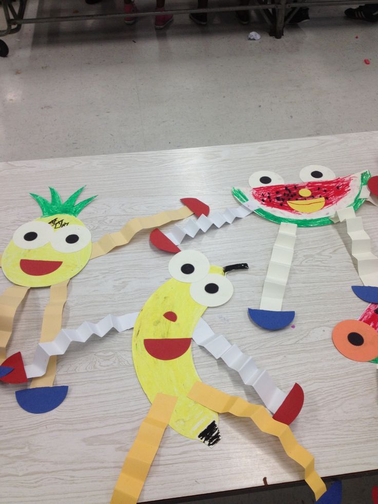 paper cut out of fruit and vegetables on a table