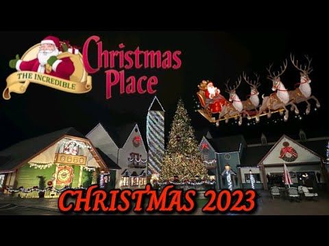 the christmas place sign with santa's sleigh and reindeers