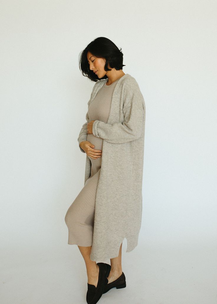 The Riviera Dress is a beautiful wide ribbed, knit midi length dress that is as comfortable as it is stylish. It's effortless, easy to dress up or keep casual - and keeps you comfortable. We love this dress paired with our Evergreen Jacket. Pregnant model is 5'9" in 3rd trimester, wearing a size medium Knee-length Knit Sweater Dress For Loungewear, Knit Sweater Dress For Loungewear, Chic Midi Sweater Dress For Loungewear, Casual Midi Sweater Dress For Loungewear, Fall Midi Dress With Relaxed Fit, Ribbed Knit Sweater Dress For Loungewear, Relaxed Fit Midi Dress For Fall, Spring Ribbed Midi Dress For Daywear, Spring Knit Midi Dress For Loungewear