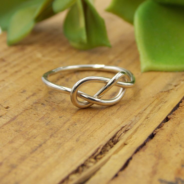 This Infinity Knot Ring is a dainty and classic ring. It's a great gift for that special someone. -14K Solid Gold -Infinity Knot Ring -Band just over 1mm thick This ring is a great gift for many occasions. It is dainty and delicate yet classic and sturdy. Each ring is handcrafted just for you and treated with care. This ring comes in your choice of Yellow Gold, White Gold, or Rose Gold (Pink Gold). Each ring comes packaged in a Ring Box ready for gift giving. It will be shipped via Priority Mail Modern Twist Infinity Stackable Rings As Gift, Classic Infinity Rings As A Gift, Classic Infinity Rings As Gift, Classic Infinity Ring As A Gift, Classic Infinity Ring As Gift, Infinity Ring With Polished Finish As Gift, Infinity Shape Stackable Fine Jewelry Rings As Gift, Classic Infinity Stackable Rings As Gift, Fine Jewelry Infinity Stackable Rings As Gift