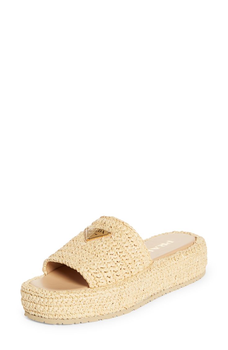 Give your warm-weather style a playful boost with this easy slide sandal crocheted in faux raffia with a shiny finish and lifted by a chunky platform. 1 3/4" heel (44mm) 1 1/4" platform; 1/2" slope (size 9) Textile upper/leather lining/synthetic sole Made in Italy Designer Shoes Luxury Summer Wedge Sandals, Luxury Slides With Textured Footbed For Spring, Vacation Slides With Woven Straw Sole, Luxury Sandals With Textured Footbed For Vacation, Summer Straw Slides With Textured Footbed, Chic Slides With Woven Sole And Round Toe, Luxury Platform Slides For Summer, Luxury Synthetic Sandals For The Beach, Luxury Beige Slides For Spring