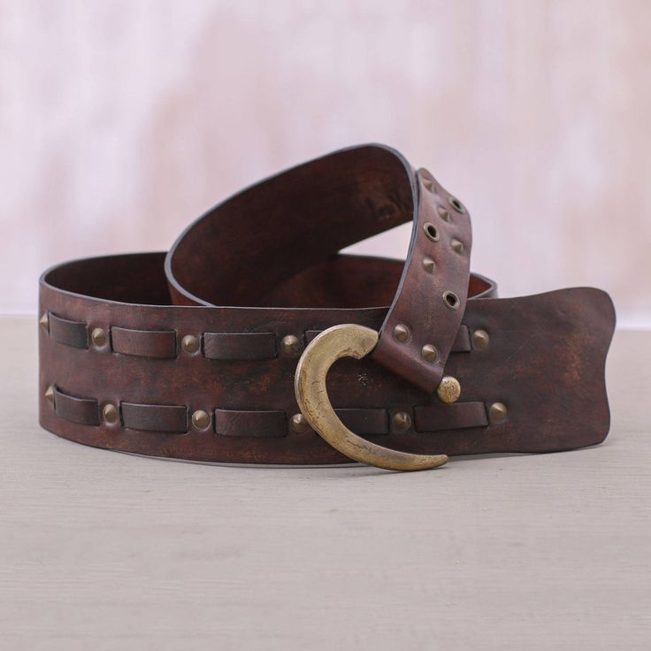 Tomomi combines warm toned leather with shiny industrial iron accents to create a truly unique belt. Two rows of leather straps are woven into the main part of the belt which are surrounded by iron studs. A contemporary hook buckle provides an adjustable closure. Imperial Leather, Iron Accents, Cow Bones, Belt Style, Metal Belt, Goat Leather, Studded Leather, Women Artisans, Leather Belts