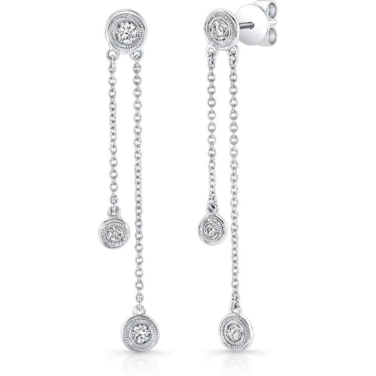 Revel in the exquisite detailing of the mesmerizing charm of our Diamond Milgrain Bezel Drop Stud Earrings in 14K White Gold. These exquisite earrings are a fusion of art and elegance, designed to capture your heart and elevate your style to new heights.Crafted with precision and passion, these earrings feature a total of 0.56 carats of round-cut diamonds, each meticulously set in a delicate milgrain bezel. The diamonds, with a stunning I-J color and SI2 clarity, glisten with every movement, casting a spell of allure that's impossible to resist.Designed for the modern woman who appreciates timeless beauty, these earrings are a part of our coveted Diamonds By The Yard collection. They're not just accessories; they're reflections of your impeccable taste and a testament to your unique style. Classic Brilliant Cut Dangle Linear Earrings, Classic Brilliant Cut Dangle Earrings, Classic 14k Gold Diamond Earrings With Elegant Design, Timeless Dangle Diamond Earrings With Elegant Design, Classic White Gold Diamond Chandelier Earrings, 14k Gold Classic Diamond Earrings With Elegant Design, Fine Jewelry Diamond Chandelier Earrings Round Shape, Timeless Elegant Dangle Diamond Earrings, Elegant White Gold Dangle Diamond Earrings