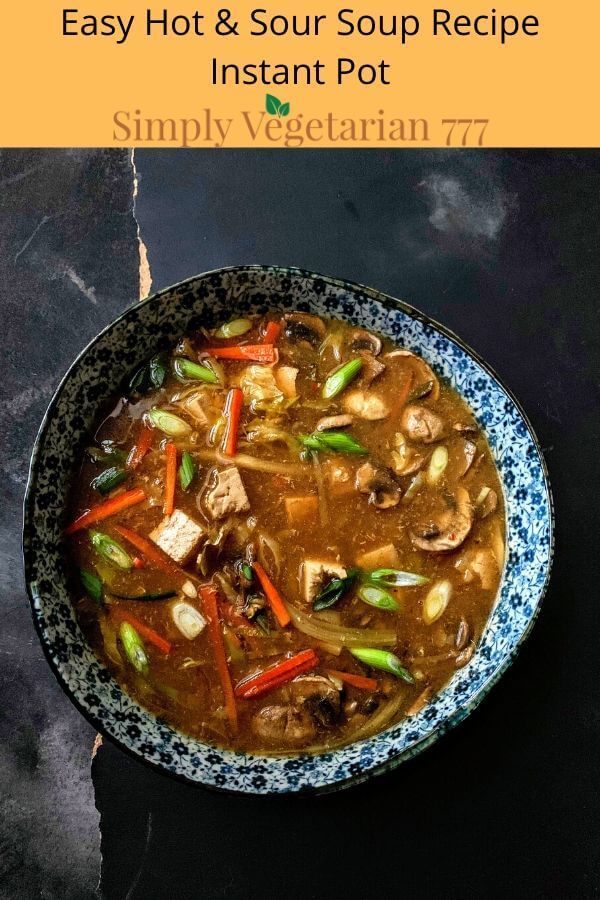 a bowl filled with soup and vegetables on top of a black table next to the words, easy hot & sour soup recipe instant pot simply vegetarian 77