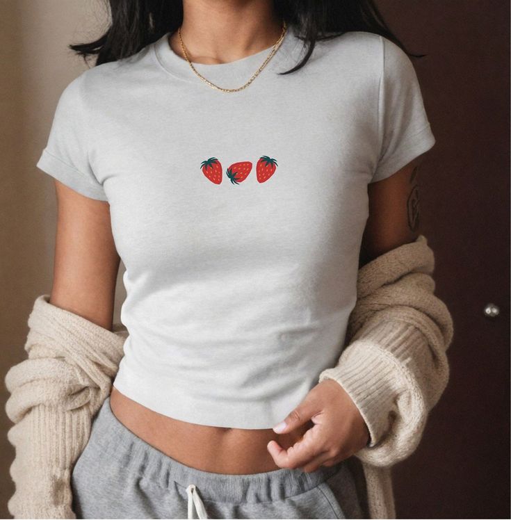 Trendy strawberry shirt in vintage retro crop top style with y2k 90s vibes. Perfect summer gift for girlfriend. Regular/Oversized Look: https://wandercraftsdesign.etsy.com/de/listing/1725102004/strawberry-shirt-comfort-colors-summer  For more variations and pictures please have a look in my shop :)  ♥PRODUCTION TIME: 1-5 days (usually 2-3 days) ♥SHIPPING TIME: 2-5 days in USA (Usually 2-3 days). International shipping takes longer. ♥PRODUCT DESCRIPTION: Gildan Kids T-Shirt Super soft cotton and Strawberry Clothes, Strawberry Tshirt, Fruit Clothing, Clothes Coquette, Original Y2k, Coquette Top, Granola Girl Aesthetic, 90s Clothes, Fruit Shirt