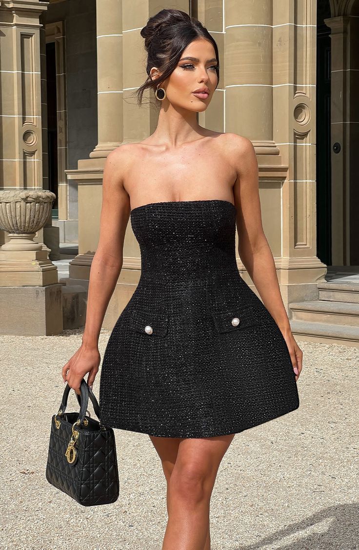 Both classy and glam in equal measures, you'll be obsessed with the Lottie mini. Crafted in our luxe textured tweed fabric, it features a strapless neckline and bubble shape skirt which is super playful. The design is complete with pearl-adorned pockets and seam details for a body-hugging fit. 



Colour: Black.

Premium textured tweed fabric.

Fully lined.

Strapless neckline.

Faux flap welt pockets with pearl button detail.

Bubble shape skirt.

Seam detail to body.

Invisible zip fastening. Black Dress With Pearls Classy, Body Hugging Dress Classy, Black Cocktail Dress Short, Homecoming Dresses Corset, White Dress Spring, Midi Dress Wedding Guest, Split Long Dress, Maxi Dress Sale, Strapless Neckline