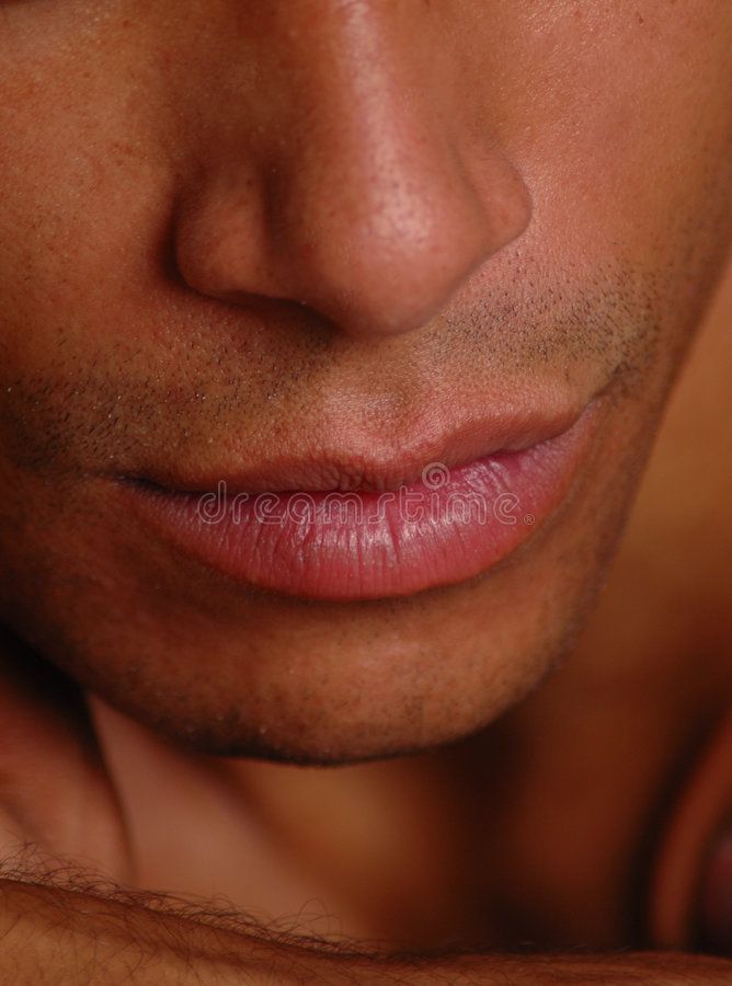 a close up view of a man's face with his hand on his chest