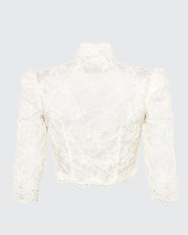 Our Bolero is a cropped scoop top with a mandarine neckline featuring three-quarter, high fitted sleeves. The Bolero is made with embroidered mesh lace and trimmed with an Alençon lace scallop trim. Embroidered mesh lace trimmed with Point d'Alençon Three-quarter sleeves Hook-and-eye closures center front Hand wash and flat dry or dry clean Each piece is made to order and handcrafted in our atelier. Fitted Cropped Lace Top With Scalloped Edges, Fitted Cropped Lace Top With Scalloped Lace, Elegant Long Sleeve Lace Crop Top, Fitted Cropped Blouse With Lace Top, Fitted Cropped Lace Top Blouse, Elegant Cropped Lace Top, Cropped Lace Tops With Lace Trim, Long Sleeve Crop Top With Lace Trim For Party, Formal Long Sleeve Tops With Scalloped Lace