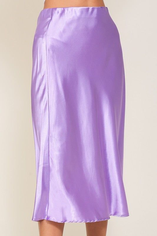 This stylish midi skirt is made from a satin fabric for a smooth and luxurious look. The bell-style shape and high-waisted silhouette make it perfect for dressing up or down - pair it with a chunky sweater and sneakers for a modern, edgy look. High waistline Midi length A-line style Non-sheer, slightly stretchy fabric Satin, 97% Polyester, 3% Spandex A US design by Timing Size Measurement (inch): S: 26" (Waist), 29.5" (Length) M: 27" (Waist), 30" (Length) L: 28" (Waist), 30.5" (Length) Midi Satin Skirt, Midi Flare Skirt, Satin Midi Skirt, Elegant Skirt, Refined Style, Activewear Sets, Skirt Fits, Embroidered Sweater, Mock Neckline