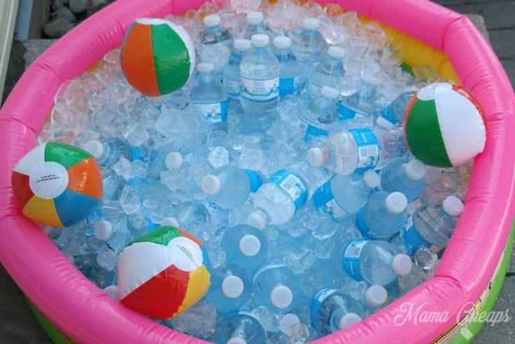 an inflatable pool filled with water and beach balls