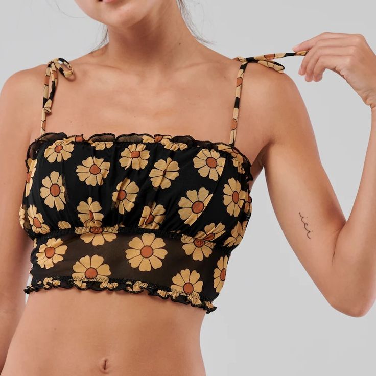 Super Pretty Black Mesh Bustier Bralette Top From Hollister/Gilly Hicks! Yellow Daisies Printed On The Material And Ties At The Shoulder. Sheer On The Bottom Half And Removable Pads. New With Tags, Never Worn Size L, True To Size (Fits D Cup And Above) Yellow Tank Top With Built-in Bra For Spring, Yellow Tank Top With Built-in Bra For Summer, Yellow Sleeveless Crop Top With Built-in Bra, Yellow Crop Top With Built-in Bra, Trendy Cami Tube Top For Beach, Yellow Tops With Built-in Bra For Spring, Yellow Fitted Camisole Crop Top, Fitted Yellow Camisole Crop Top, Yellow Camisole Crop Top For Spring