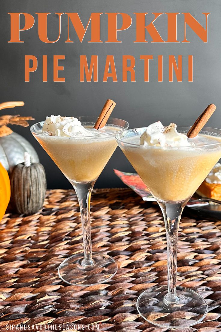 two glasses filled with pumpkin pie martini on top of a wicker table next to an orange pumpkin