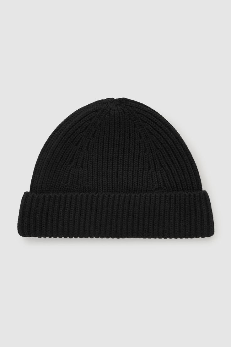 A true winter essential, this short beanie hat is crafted from merino wool and has a fold-over panel. It has a ribbed-knit construction to lock in warmth.     100% Merino wool Short Beanie, Hats Collection, True Winter, Beanie Style, Men's Hats, Wool Beanie, Knitwear Men, Mens Gloves, Winter Essentials