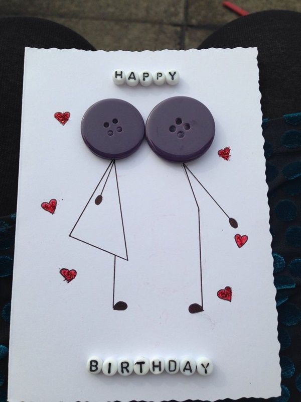 a birthday card with two buttons on it