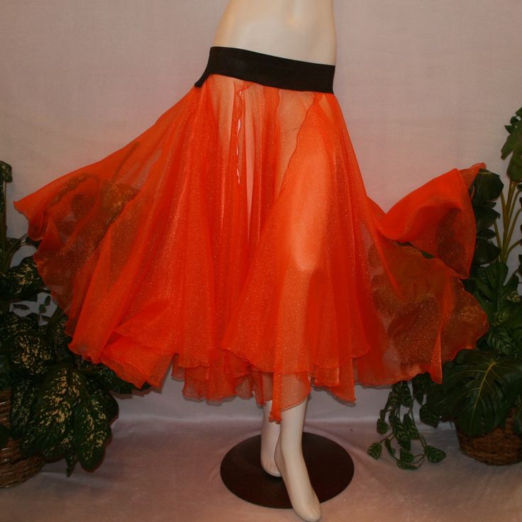 Orange ballroom skirt in yards of large petal shape panels of orange organza with a brown waistband to pair with one of our Fall Flowers dresses to create a converta ballroom dress.   The skirt can be custom made in many other colors. Fitted Orange Organza Dress, Orange Ruffled Flowy Skirt, Fitted Organza Skirt With Attached Cancan, Fitted Dance Petticoat, Stretch Orange Skirt For Party, Orange Full Skirt, Orange Fitted Party Skirt, Orange Fitted Skirt For Party, Fitted Orange Skirt For Party