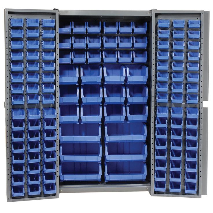 the storage cabinet is full of blue bins