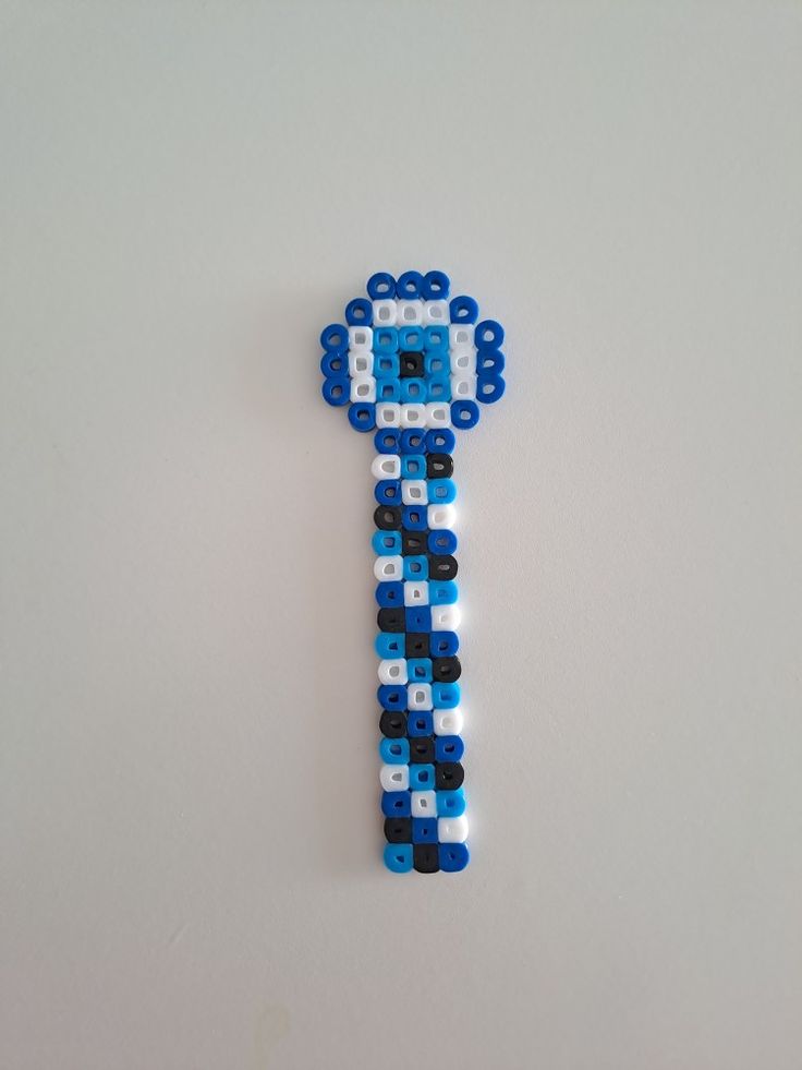 a blue and white clock made out of legos