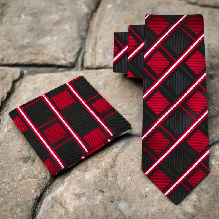 This silk necktie features a sophisticated geometric diamonds pattern in black and red, adding a bold and stylish element to your attire. Dress Shirts: Pair this necktie with dress shirts in solid colors such as: White Light gray Pale blue These colors complement the tie's black and red tones, allowing the geometric pattern to stand out sharply. A subtle stripe or small-scale pattern in coordinating colors can also enhance the tie's modern design. Suits: Opt for suits in classic colors like: Cha Black Tie With Pocket Square For Business, Dapper Black Ties For Gift, Dapper Black Tie For Gift, Black Dapper Suit And Tie Accessories For Business, Black Suit And Tie Accessories With Pocket Square, Dapper Red Suit And Tie Accessories For Formal Occasions, Dapper Red Suit And Tie Accessories For Formal Events, Dapper Black Tie With Pocket Square, Semi-formal Black Suit And Tie Accessories