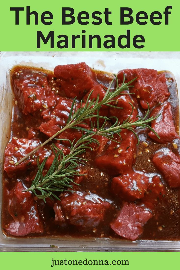 the best beef marinade recipe in a plastic container with rosemary garnish on top