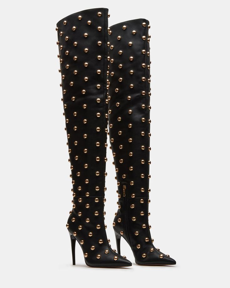 Elevate your look with SPRITZ, the over-the-knee studded heeled boot . The pointed toe adds a touch of sophistication to any outfit. Stand out from the crowd with this stylish and unique boot.  4 inch heel height Size 6 measurements: 19 inch shaft circumference, 23.75 inch shaft height Size 8 measurements: 20 inch shaft circumference, 24.75 inch shaft height Size 10 measurements: 21 inch shaft circumference, 25.75 inch shaft height Vegan leather upper material with studs Textile and vegan leather lining Synthetic sock Synthetic sole Imported Black Pointed Toe Heels, Unique Boots, Gold Boots, Cute Shoes Heels, Fantastic Shoes, Pointed Toe Boots, Studded Boots, Stiletto Boots, High Heel Boots Ankle