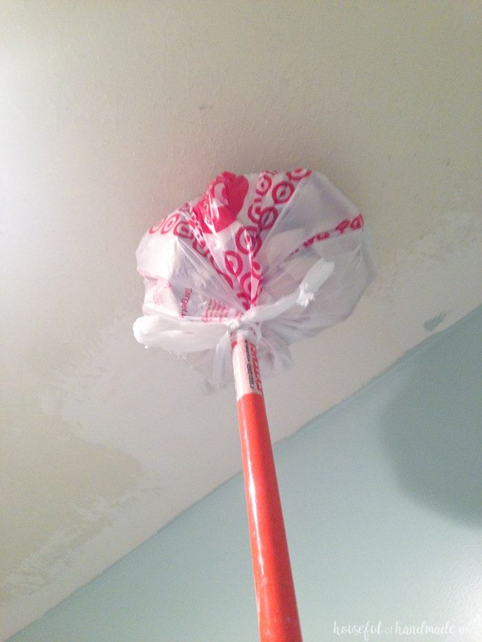 a red and white umbrella is hanging from the ceiling