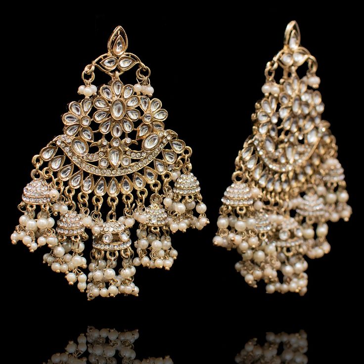 A beautiful blend of intricacy and elegance! Handcrafted with precision, this pair features beautiful stone work. Approximate earrings length is 4". The earrings are available in 2 options: Earrings with Saharay Earrings without Saharay Please select the desired option at the time of purchase. Gold-plated on high-quality brass as base metal. Made by order. Kindly allow 4-6 weeks for the delivery of this item. For custom or urgent requests, please contact support@alacouture.com. *Please Note: We Faux Stone, Stone Work, Base Metal, Free Gifts, Diamond Earrings, Gold Plate, Crown Jewelry, Plating, Brass