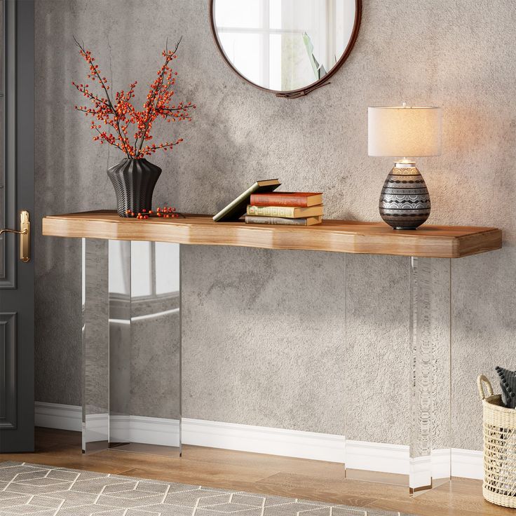 a table with a mirror and vase on it in front of a wall mounted clock