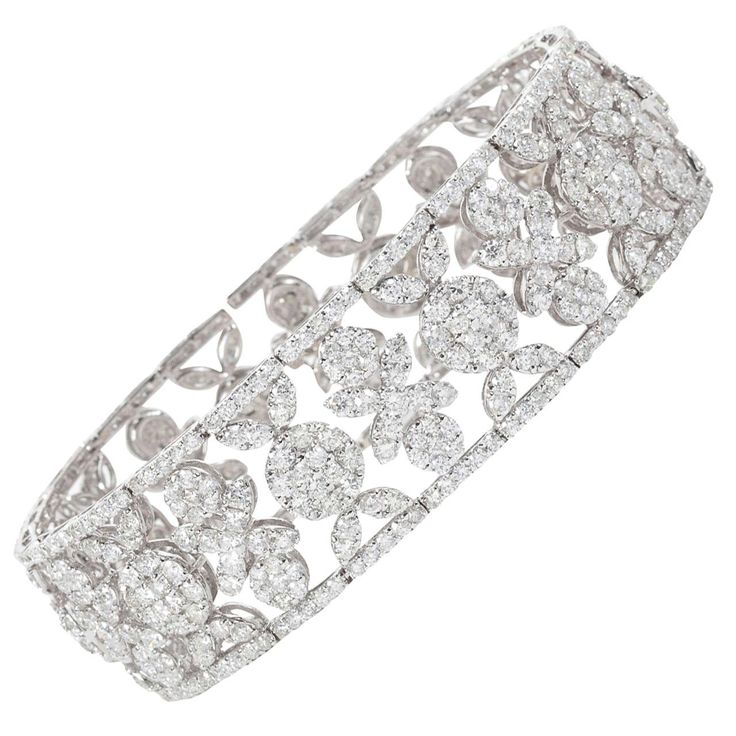 Classic Wreathe Style Wide Diamond Bracelet 20.03 carats of round brilliant cut diamonds set in an exquisite timeless design. Set in 18k white gold Approx 3/4 of an inch in width Gold Band Bracelet, Cluster Jewelry, White Diamond Jewelry, Bangle Diamond, Classic Wreath, Diamond Chandelier Earrings, Cluster Bracelet, White Gold Bangle, Diamond Bracelet Design