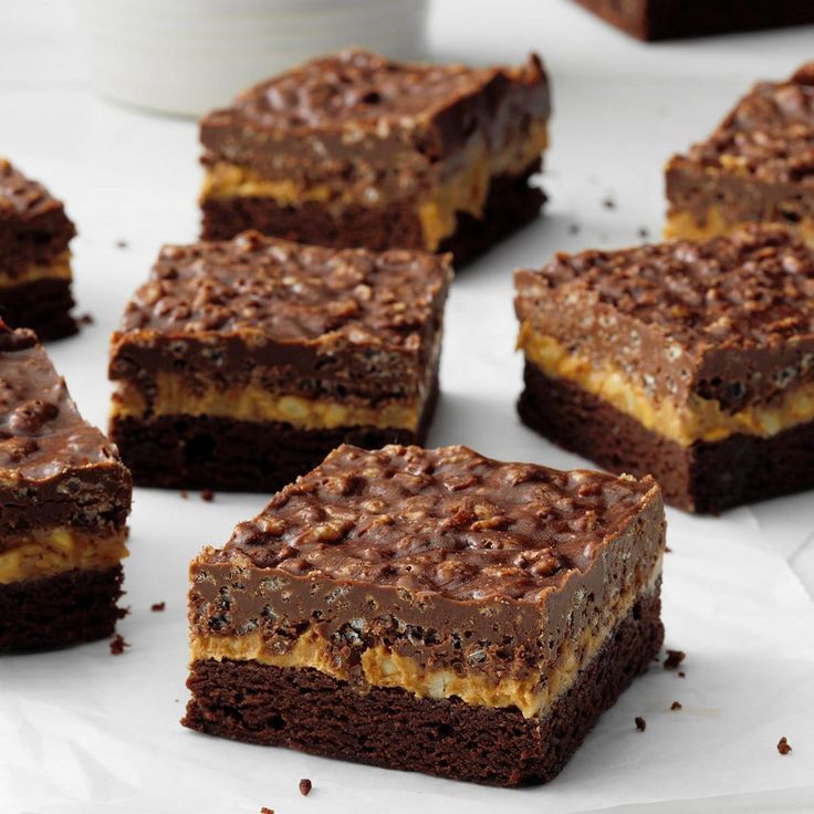 several pieces of brownie with chocolate frosting on top