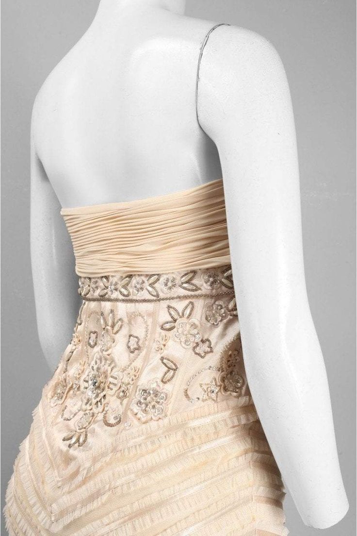 All New Yorker’s Apparel dresses will ship orders every Friday. Catch everyone????s attention as you walk elegantly in this Sue Wong N0230 gown. Lush ruching textures the bodice of this stylish dress, ornate with gorgeous beaded flowers to highlight the waist. The skirt is comprised of sheer tulle ruffles over silky chiffon, edged with tulle at the hem. This creation from Sue Wong fashion is stunning look for your evening occasion. Style: suwo_N0230 Details: Strapless, Floral bead details, Ruche Couture Gown With Fitted Bodice And Ruffles, Couture Gown With Ruffles And Fitted Bodice, Elegant Sleeveless Ball Gown With Boned Bodice, Elegant Strapless Ball Gown With Ruched Bodice, Elegant Fitted Strapless Ball Gown, Couture Fitted Strapless Evening Dress, Elegant Sleeveless Ball Gown With Ruffles, Embellished Strapless Dress With Fitted Bodice For Evening, Elegant Ball Gown With Boned Bodice