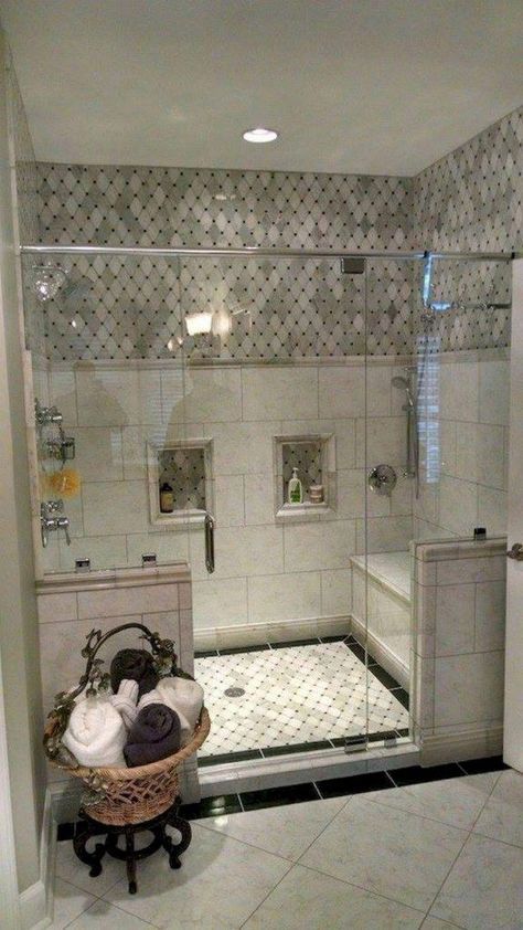 a bathroom with a walk in shower next to a sink