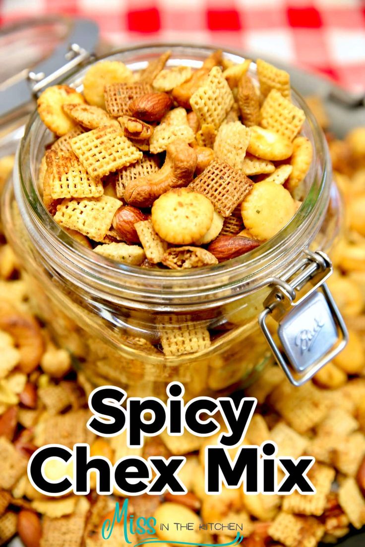 a jar filled with chex mix sitting on top of a table