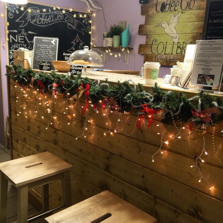 the counter is decorated with garland and lights