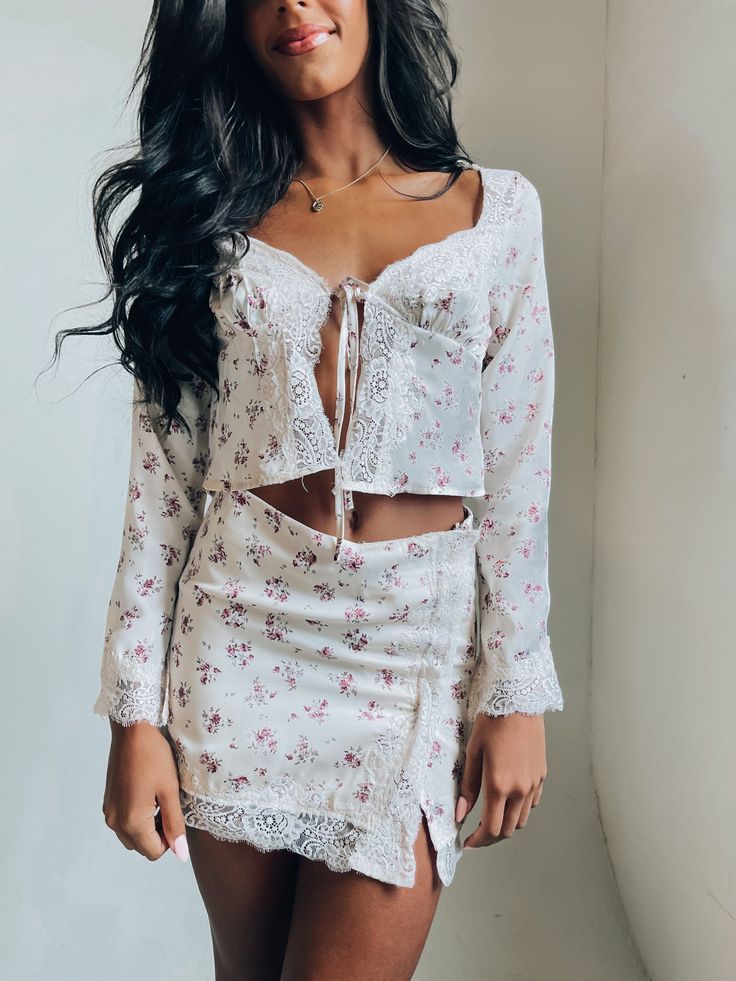 DETAILS: Our Juliet Floral Lace Set is a two piece set with a mini skirt and a long sleeved top. The top is a long sleeved item that is NOT LINED and has a pretty floral patter all over. There is a eyelet lace detail along the middle of the top and the cuffs of the sleeves. The middle of the top has a self tie closure. The bottom of this set is a mini skirt that has a high waisted fit. The skirt also has an all over floral pattern and eyelet lace on the hem and along the crossover slit. The insi Nature Vibes, White Two Piece, Lace Set, Long Sleeved Top, Custom Jacket, Eyelet Lace, Flowy Skirt, Two Piece Set, Pop Up Shop