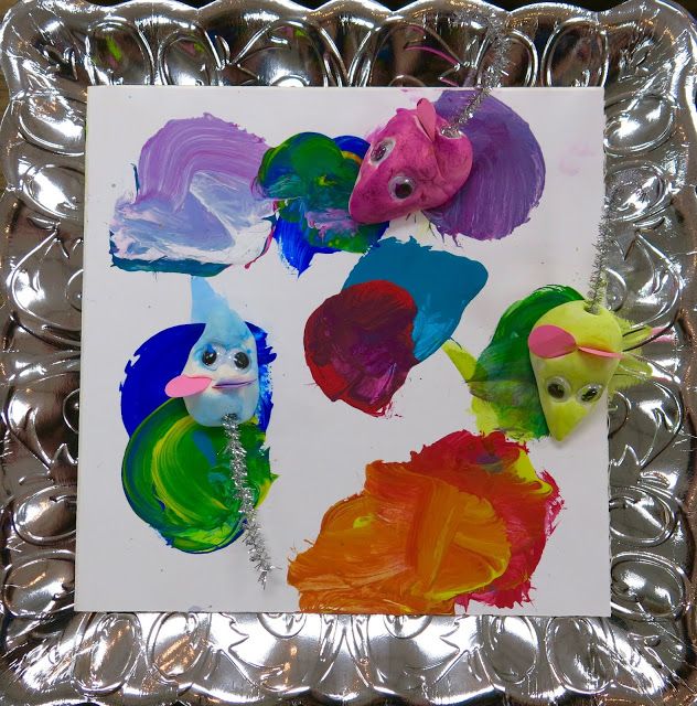 a metal tray with some colorful art on it