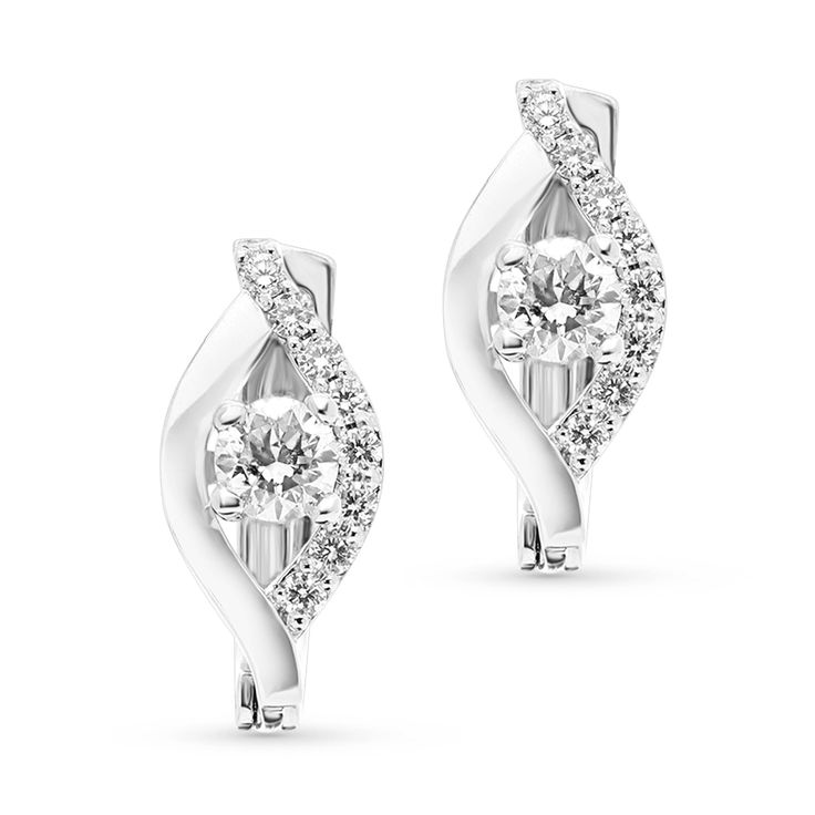 Celebrate your changing, growing and evolving romance with these exceptional diamond flame huggie. Expertly crafted in 18K white gold, each earring features a unique cascading drop outlined with polished and shimmering diamonds. Anchoring each earring, a single round diamond glistens in a unique setting that moves with every beat of her heart and every turn of her head. 
0.52 carat center round cut diamonds
0.26 carat diamond pave setting
18k white gold
The earring design can be c Modern Diamond White Hoop Earrings With Single Cut Diamonds, White Diamond Earrings With Diamond Accents, Classic White Hoop Earrings With Single Cut Diamonds, Modern White Gold Earrings With Diamond Accents, White Diamond Earrings With Accents, White Huggie Earrings With Single Cut Diamonds For Anniversary, Modern Round Cut Halo Diamond Earrings, Modern White Diamond Earrings For Anniversary, Modern Diamond Earrings With Halo Design