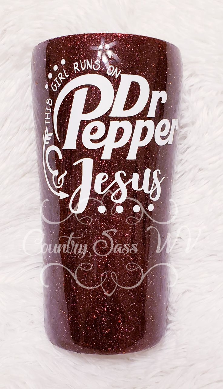 a red glittered tumbler with the words dr pepper and jesus printed on it