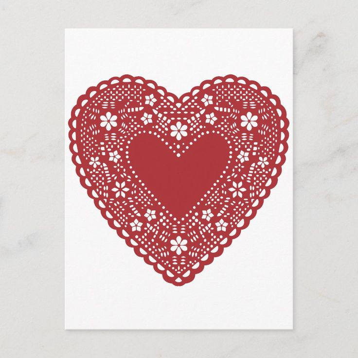 a red doily heart card on a white background with the word love written in it