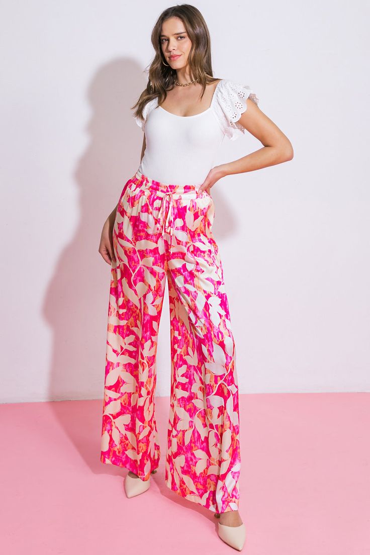 An exquisitely crafted woven pant, adorned with an elasticized waistband complete with a tasteful tacked tie and flowing wide leg design. Matching top IT12981Details:Self : 100% PolyesterLining : 100% PolyesterSize & Fit- Model is 5`8" And Wearing Size Small- Measurements Taken From Size Small- Approx. Length: 43" Spring Wide Leg Ankle-length Pants With Tie Waist, Spring Ankle-length Wide Leg Pants With Tie Waist, Spring Wide Leg Tie Waist Pants, Spring Straight Pants With Tie Waist, Trendy Spring Wide Leg Pants With Tie Waist, Trendy Wide Leg Pants With Tie Waist For Spring, Chic Pink Bottoms With Tie Waist, Elegant Pink Bottoms For Vacation, Trendy Wide Leg Pants With Tie Waist