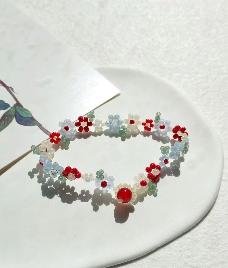 ❤️This exquisite Handmade Flower Beaded Bracelet is meticulously crafted and adorned with delicate beads. A perfect accessory for any occasion, this bracelet adds a touch of elegance and charm to any outfit. Handmade with care, it boasts superior quality and design. Elevate your style with this stunning bracelet❤️ 🐳100% Handmade Beaded Bracelet Each one is unique🐳 Dainty Flower-shaped Bracelet With Colorful Beads, Spring Flower Charm Beaded Bracelets As A Gift, Spring Beaded Bracelets With Flower Charm As Gift, Adjustable Beaded Bracelets With Flower Shape, Spring Crystal Bracelet With Round Beads As Gift, Dainty Flower-shaped Beaded Bracelets With Spacer Beads, Spring Festival Gift Bracelets With Round Beads, Spring Gift Bracelets With Round Beads, Spring Beaded White Pearl Bracelet