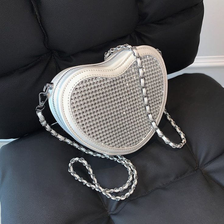 Be classy but sassy, with rhinestone detail in a heart shape design bag and a classic vintage style chain. Size: 18 x 14 x 5cm Elegant Heart-shaped Bags, Chic Rhinestone Shoulder Bag As Gift, Heart-shaped Evening Bag With Chain Strap, Heart-shaped Evening Bags With Chain Strap, Heart-shaped Shoulder Bag With Chain Strap For Party, Heart-shaped Party Shoulder Bag With Chain Strap, Chic Heart-shaped Shoulder Bag For Party, Heart Shape Design, Be Classy