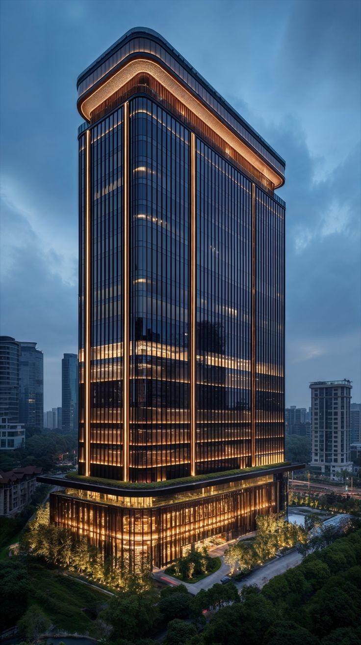 an office building lit up at night in the city