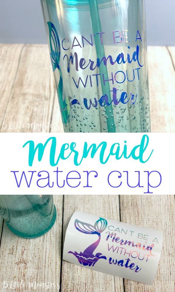 the mermaid water cup has two straws in it and is next to an empty bottle