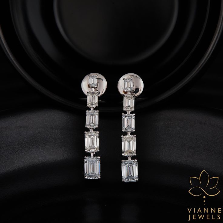 Experience unparalleled elegance with this intricately crafted earring set showcasing a combined weight of 5.31 total carats. Each earring features a pristine emerald cut lab-grown diamond, renowned for its elongated rectangular shape and stepped facets, which captures and reflects light spectacularly. Set in high-quality precious metal, these earrings are a testament to sustainable luxury and modern craftsmanship. Their exceptional clarity, coupled with a remarkable cut, ensures a shimmering display of brilliance and fire from every angle. Perfect for those special occasions or as an exquisite daily accessory, this pair promises a timeless appeal and a lasting impression. By choosing lab-grown diamonds, you're also making a conscious decision to support ethical and environmentally friendl Anniversary Wedding Gifts, 19 Days, Hand Crafted Jewelry, Crafted Jewelry, Anniversary Wedding, Precious Metal, Memorable Gifts, Emerald Cut, Last Minute Gifts