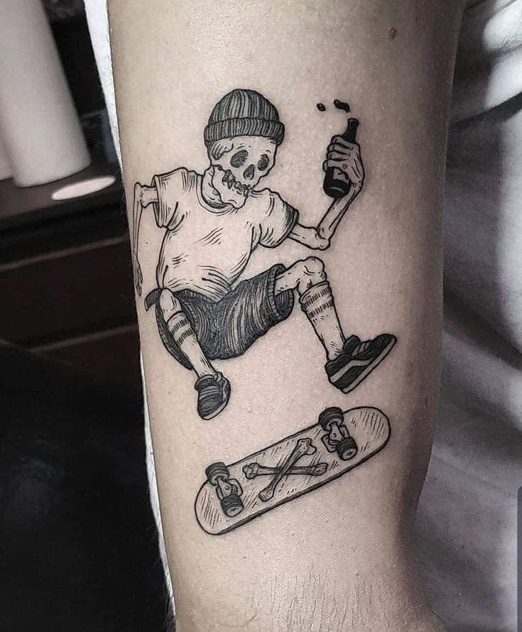 a man with a skateboard and skull tattoo on his arm