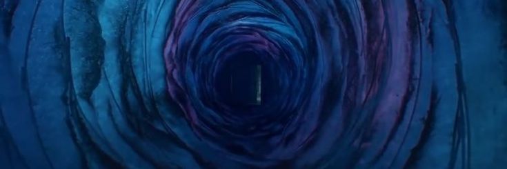 an abstract blue and purple tunnel with light at the end